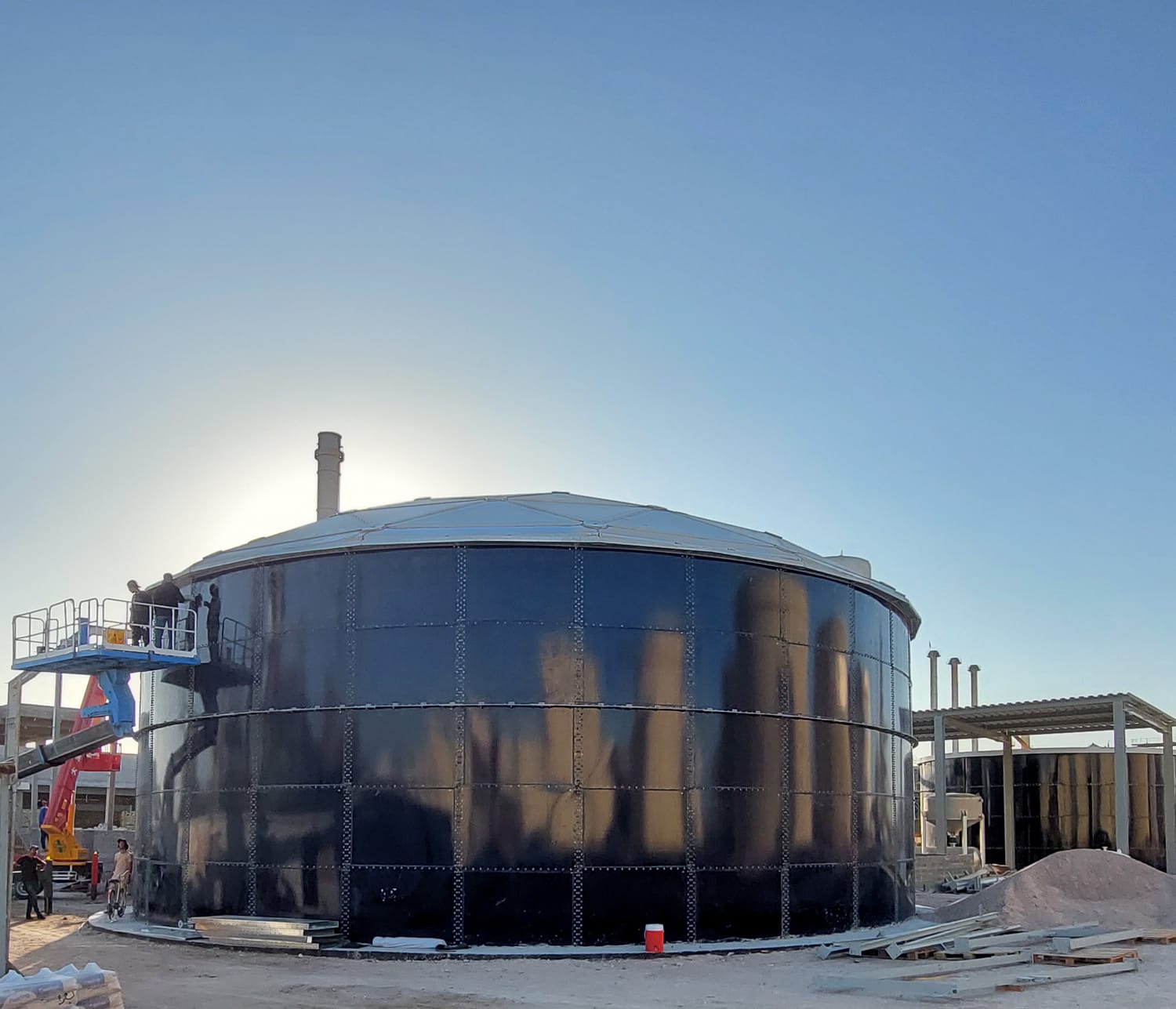 Completed glass-fused bolted storage tank on a prepared foundation